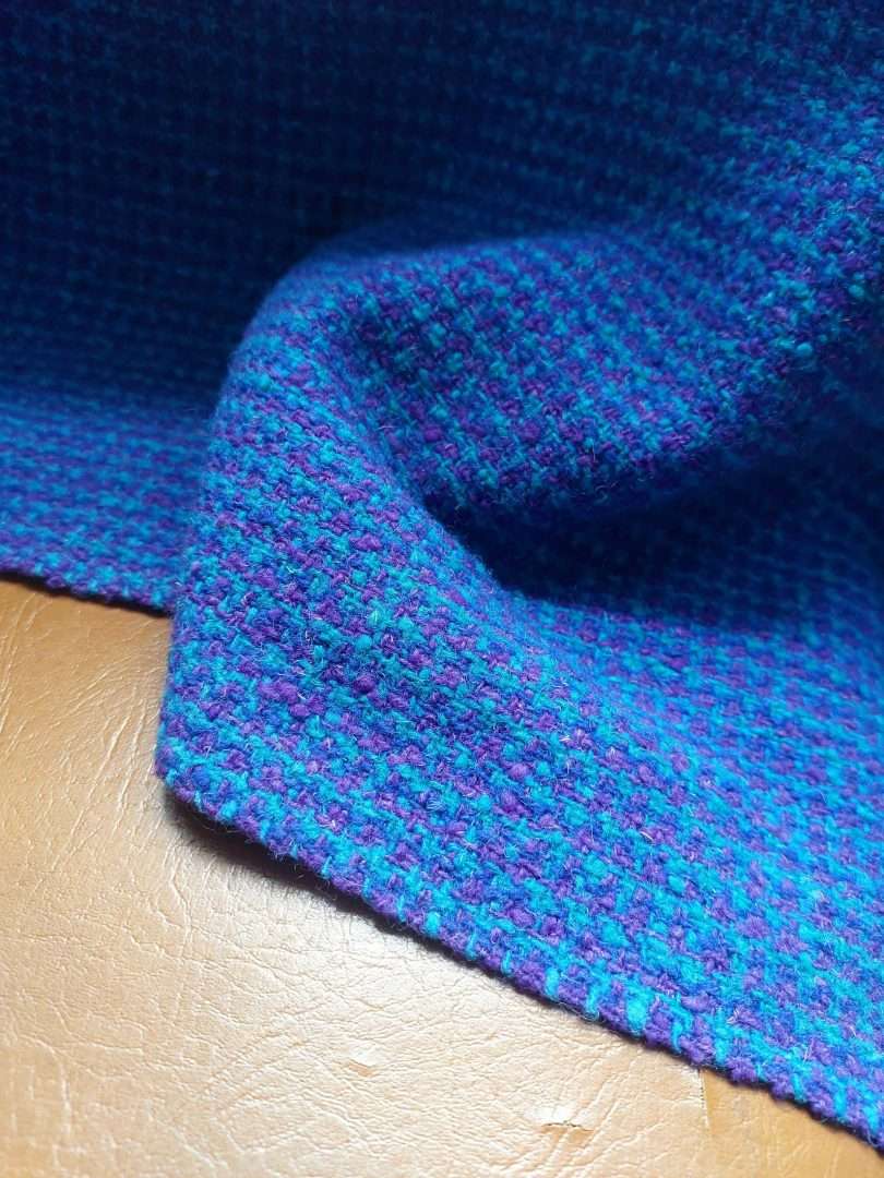close up of blue tweed fabric